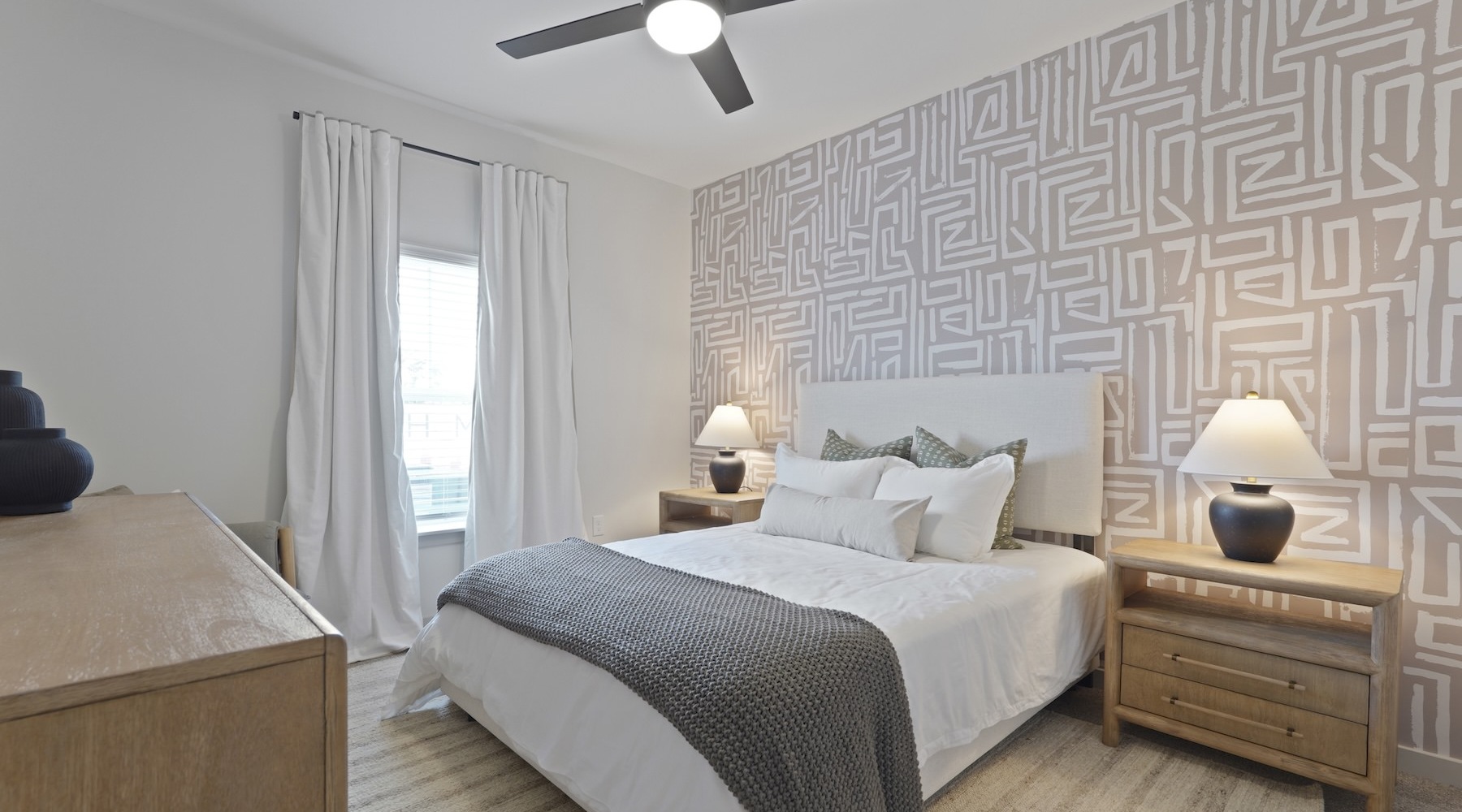 bedroom with ceiling fan lamp and tables