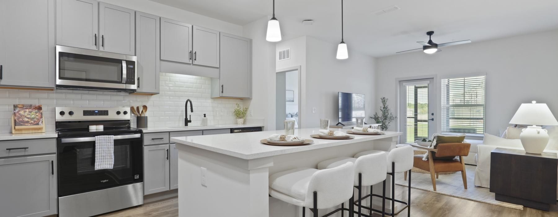 a kitchen with white cabinets